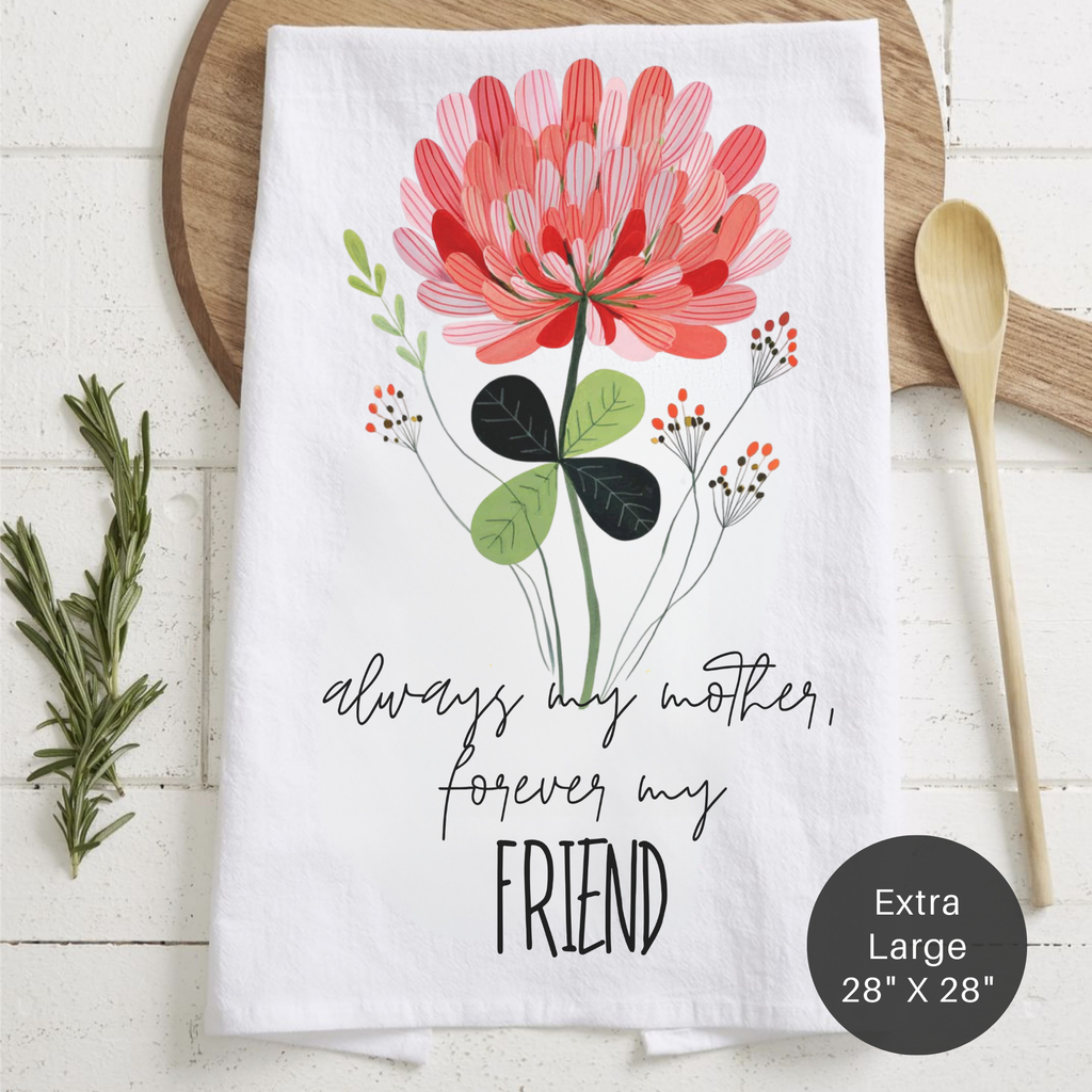 Floral-themed towel with 'always my mother, forever my friend' text on a wooden surface.