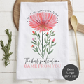 Floral-themed towel with a quote 'The Best Parts Of Me Came From You'  on a wooden surface