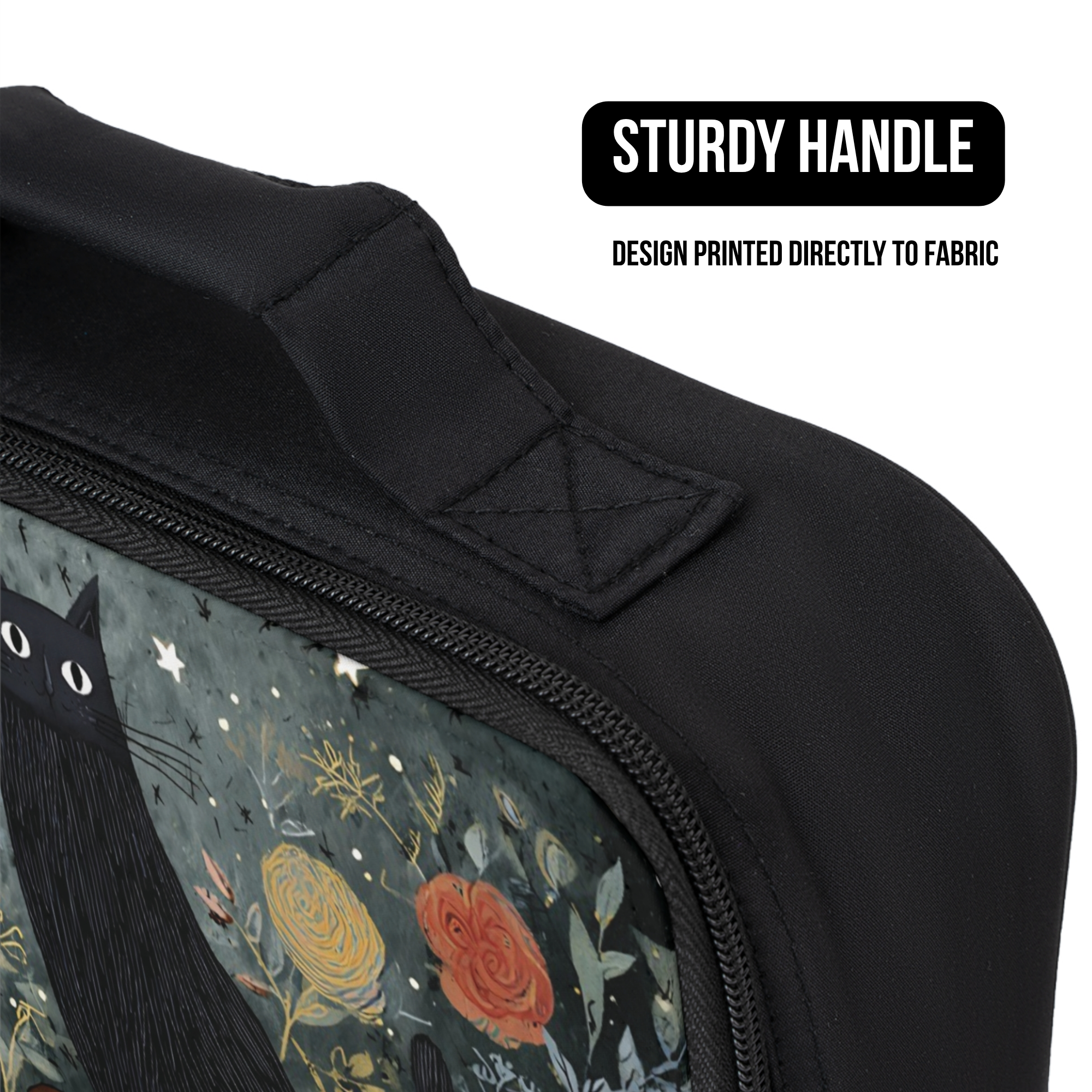 Black lunch bag with floral design and cat illustration, featuring a sturdy handle and design printed directly to the fabric.