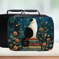 Insulated lunch bag with a cat design on a blue background