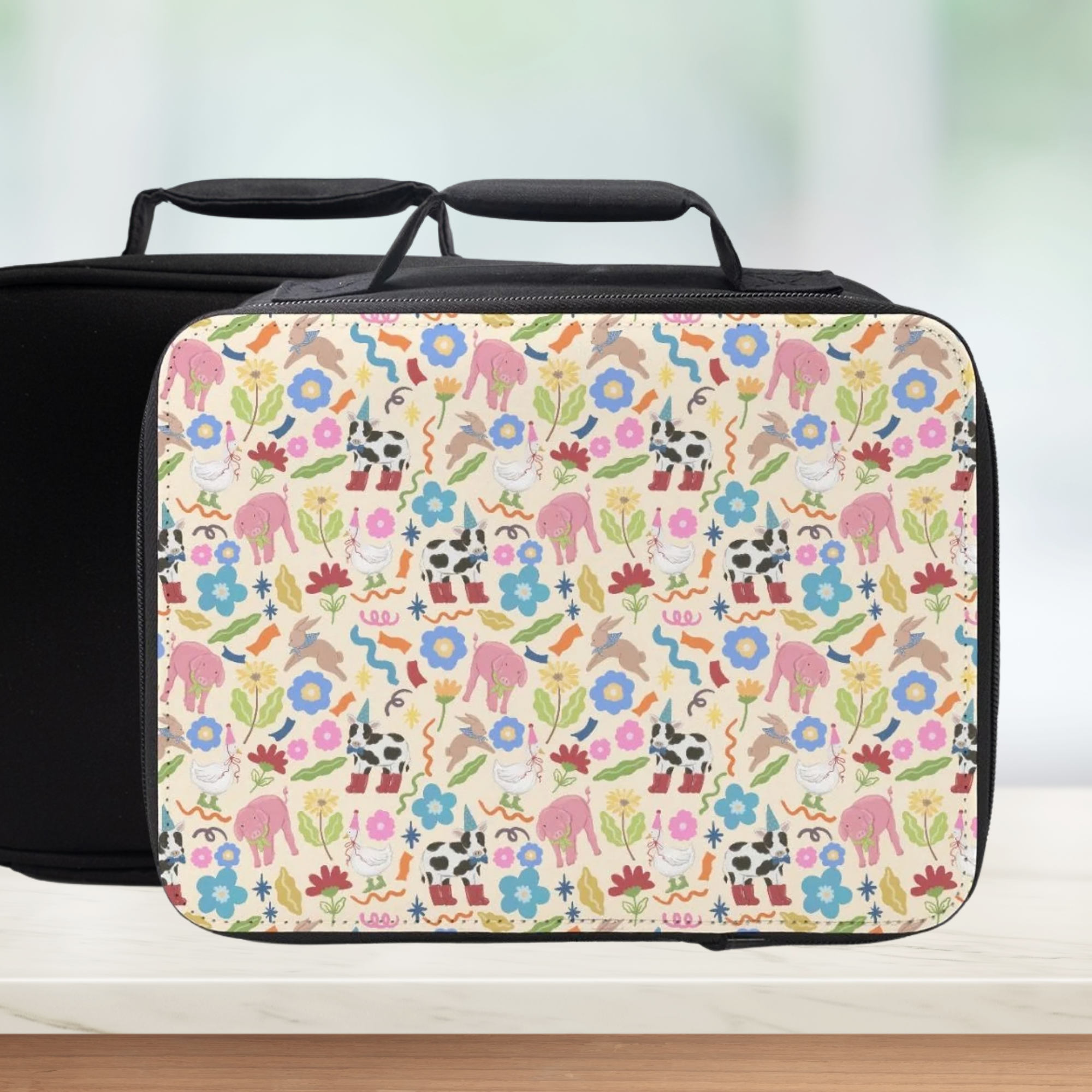 Lunch bag with a colorful animal & flowers pattern on a white background