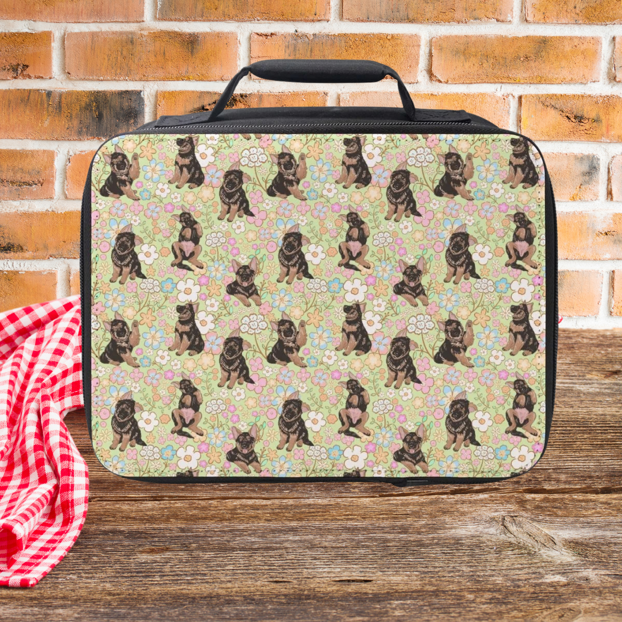 Lunch bag with hand drawn floral dog pattern on a wooden picnic table and brick wall background