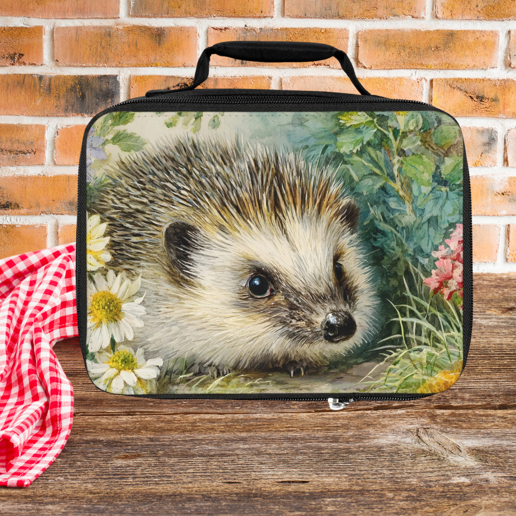 Lunch bag with a hedgehog design on a wooden picnic table and brick wall background