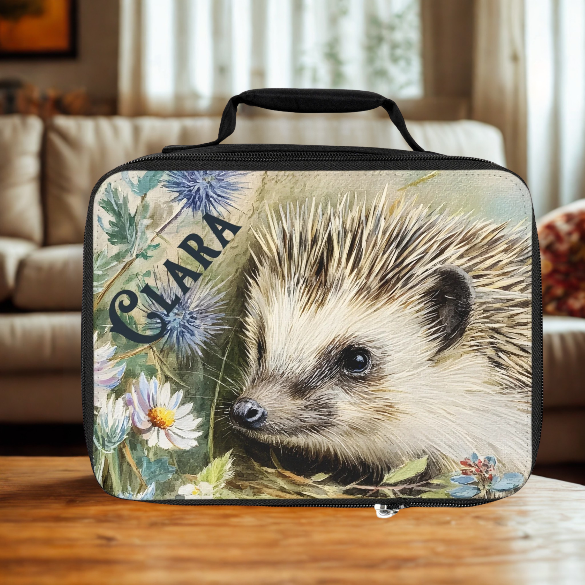  insulated lunch bag with a personalized hedgehog design on a wooden living room table.