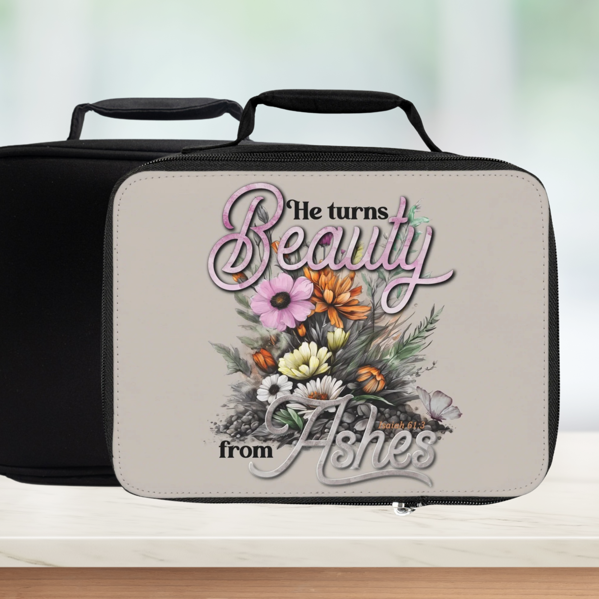 Insulated lunch bag with floral design and text on a white background