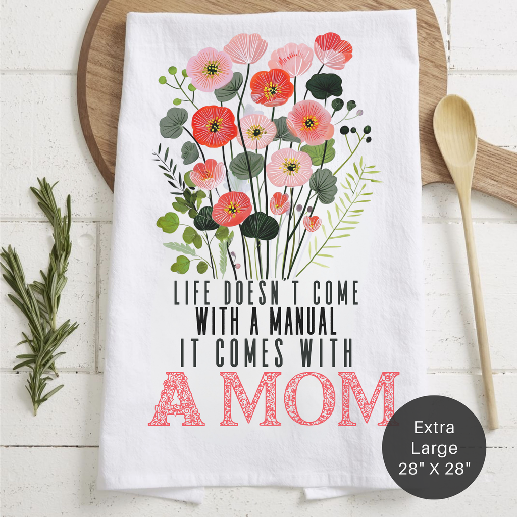 Floral-themed towel with motivational quote on a wooden surface