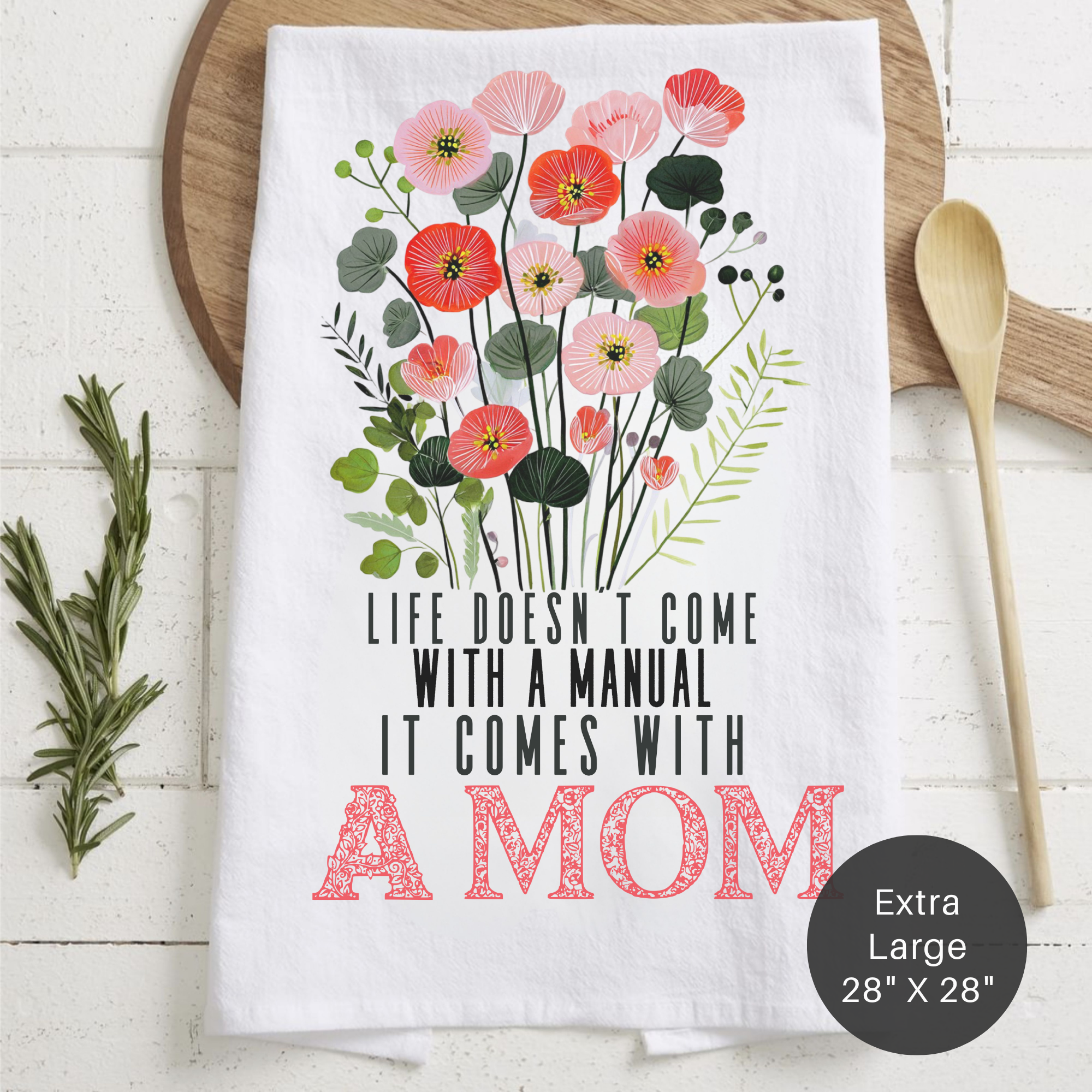 Floral-themed towel with motivational quote on a wooden surface
