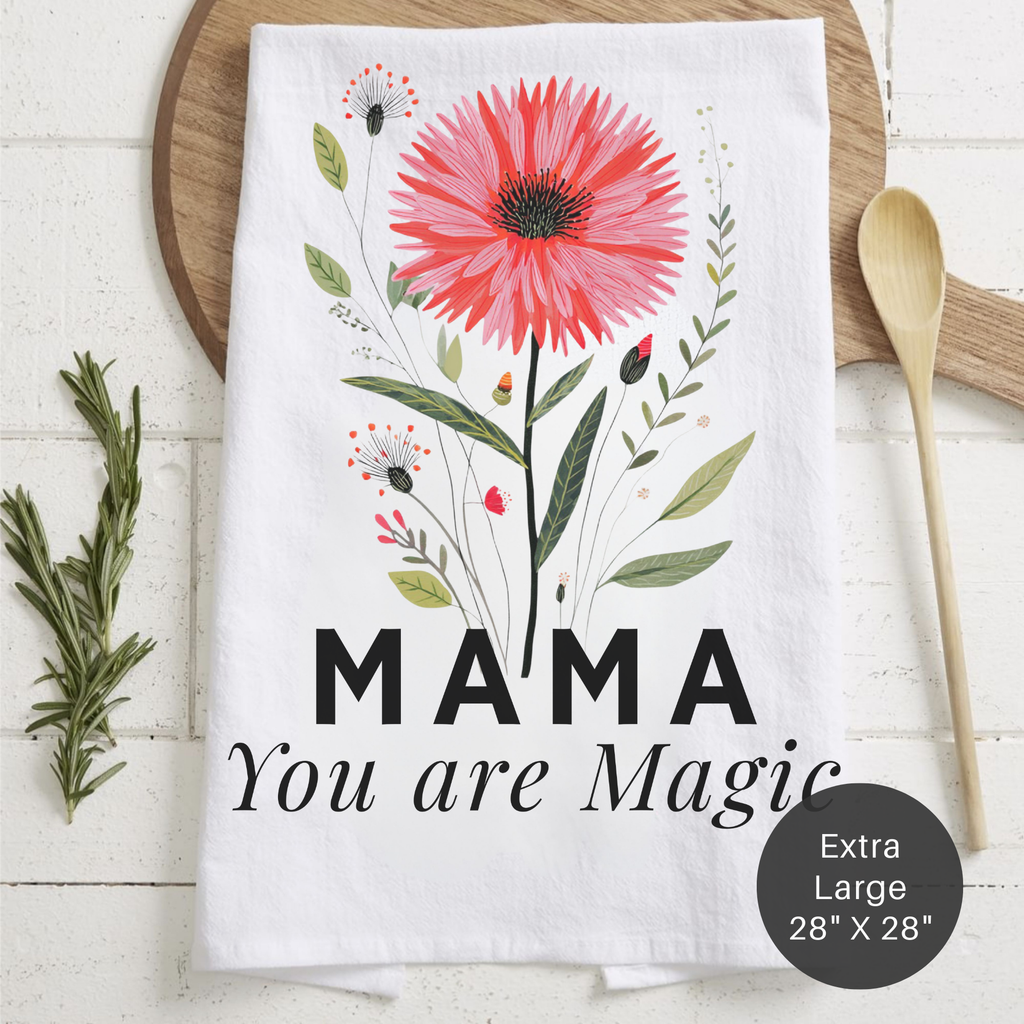 Floral towel with 'MAMA You are Magic' text on a wooden surface