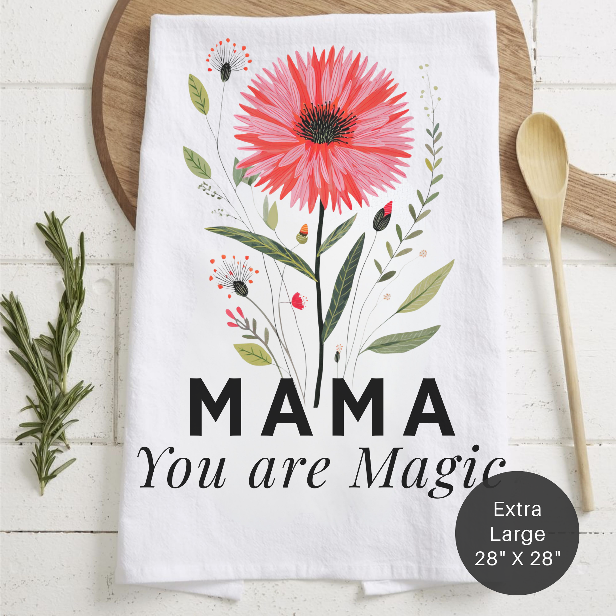 Floral towel with 'MAMA You are Magic' text on a wooden surface