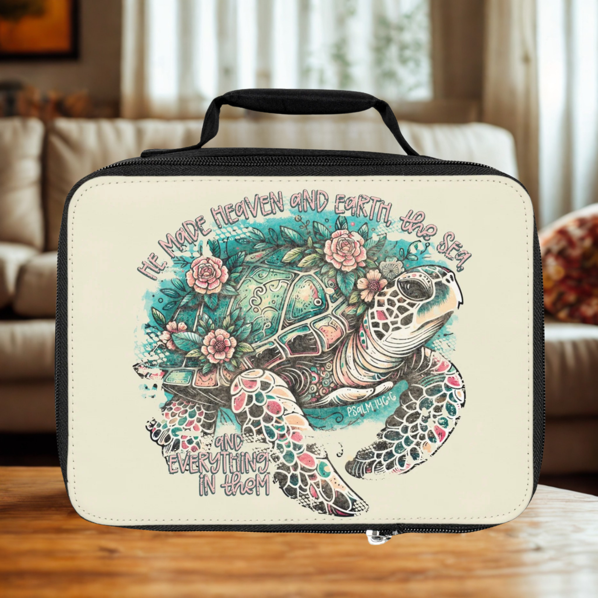  insulated lunch bag with turtle design and text on a wooden coffee table in a cozy living room
