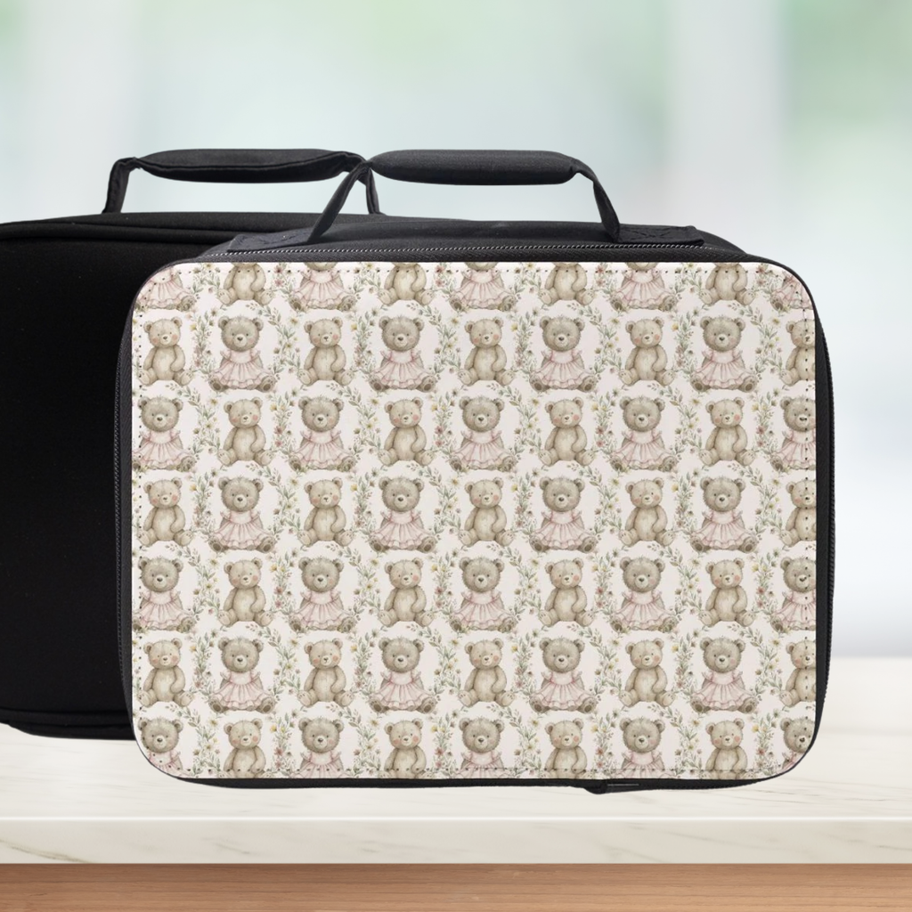 Insulated lunch bag with teddy bear pattern on a light background