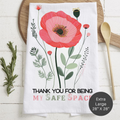 Floral-themed towel with text 'Thank You For Being My Safe Space' on a wooden surface