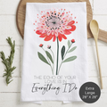 Floral design towel with text 'The Echo Of Your Love Is In Everything I Do' on a wooden surface