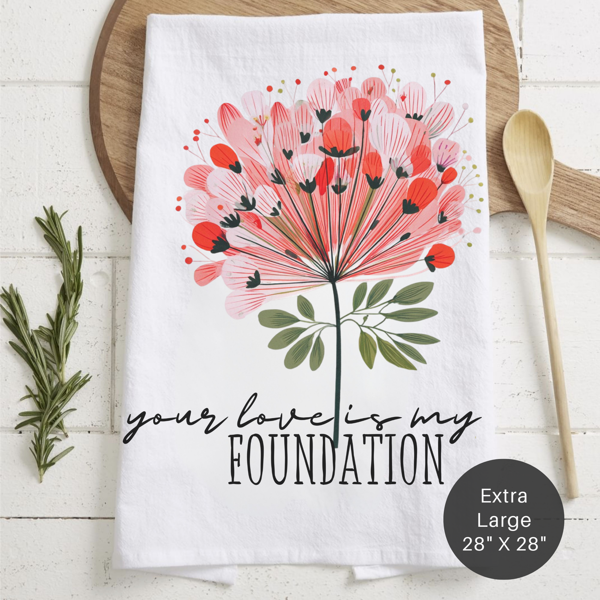 Extra large tea towel with floral design and text 'Your Love Is My Foundation' on a wooden surface
