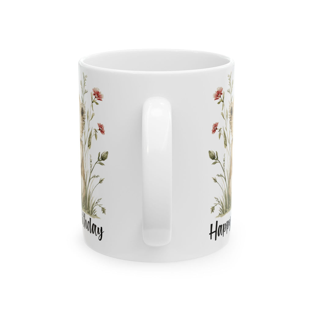 White mug with floral designs and text on a white background
