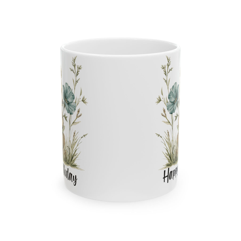 White mug with floral designs and text on a white background