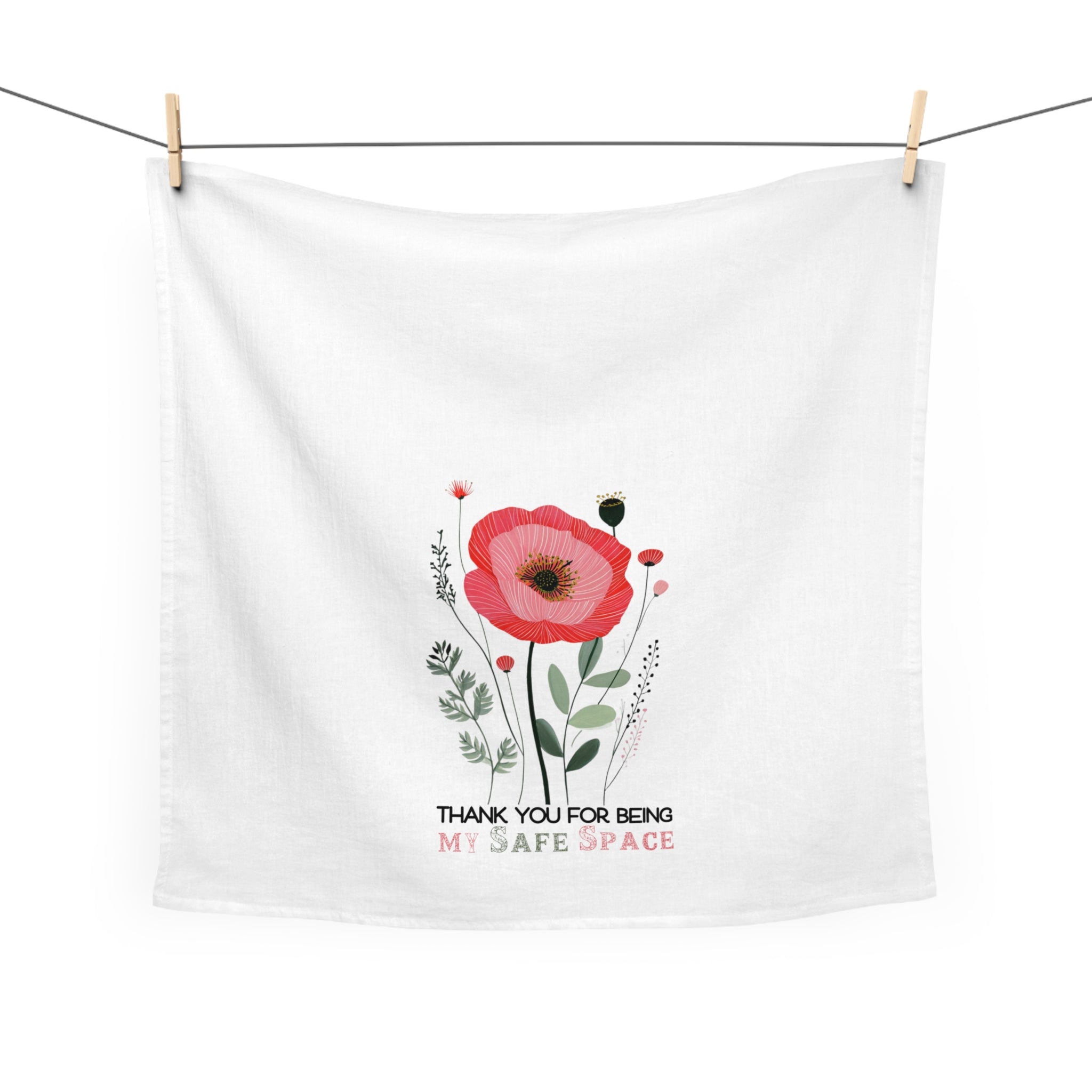 White towel with a red flower design and text on a white background