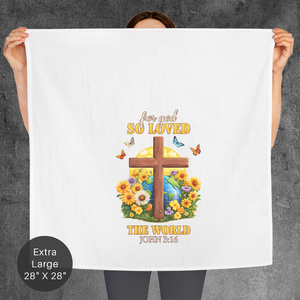 Person holding a large tea towel with a cross and floral design, featuring text on a gray background.