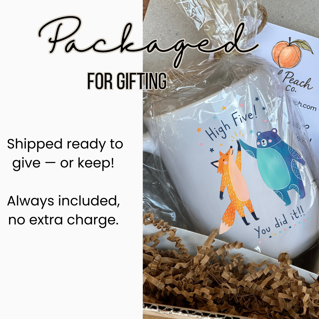 Mug in gift packaging  with cartoon animals and text 'High Five! You did it!' on a white background.