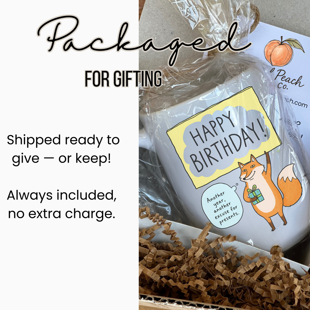 Gift wrapped mug with a fox illustration and information about packaging