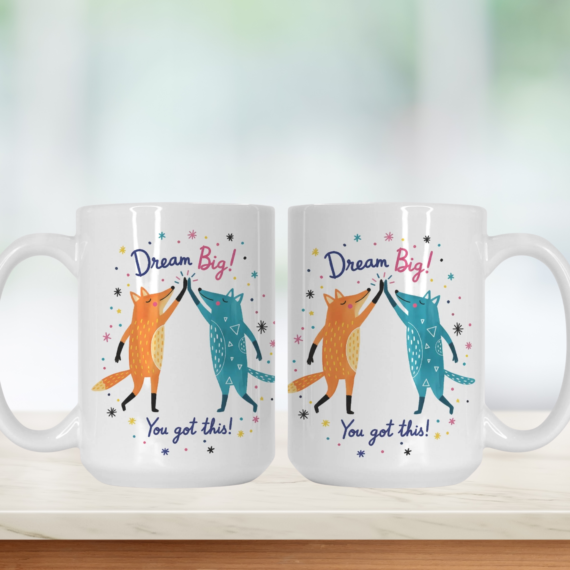 Two mugs with fox illustrations and motivational text on a white background