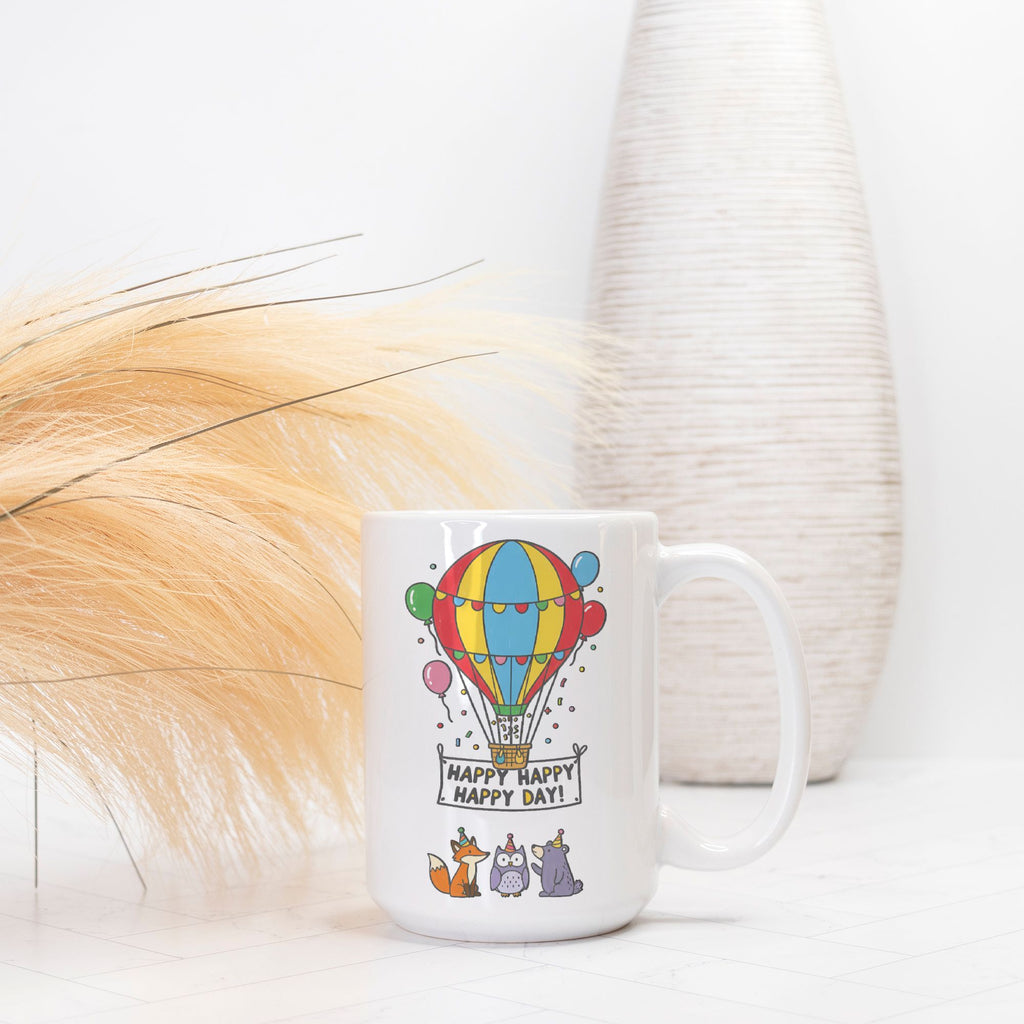 White mug with colorful hot air balloon design and text on a white background