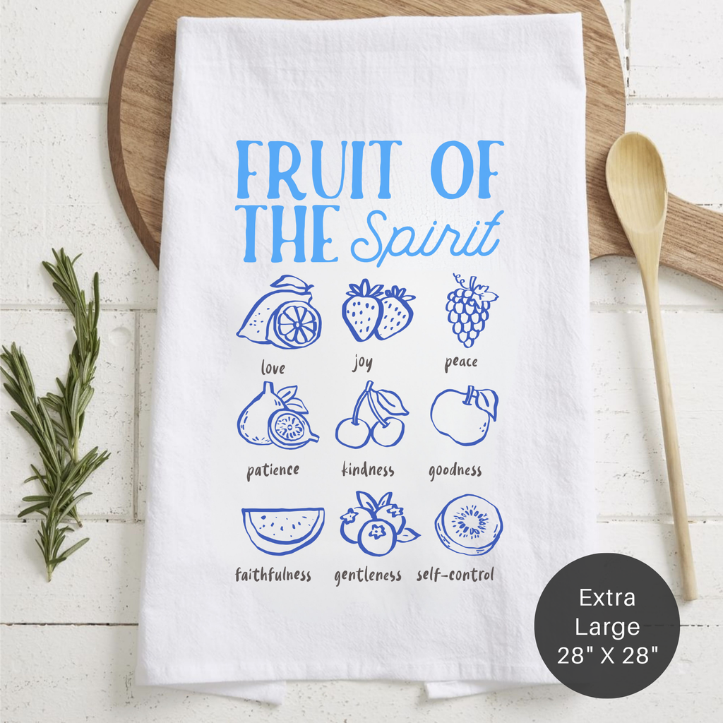 White tea towel with blue graphics and text on a wooden surface