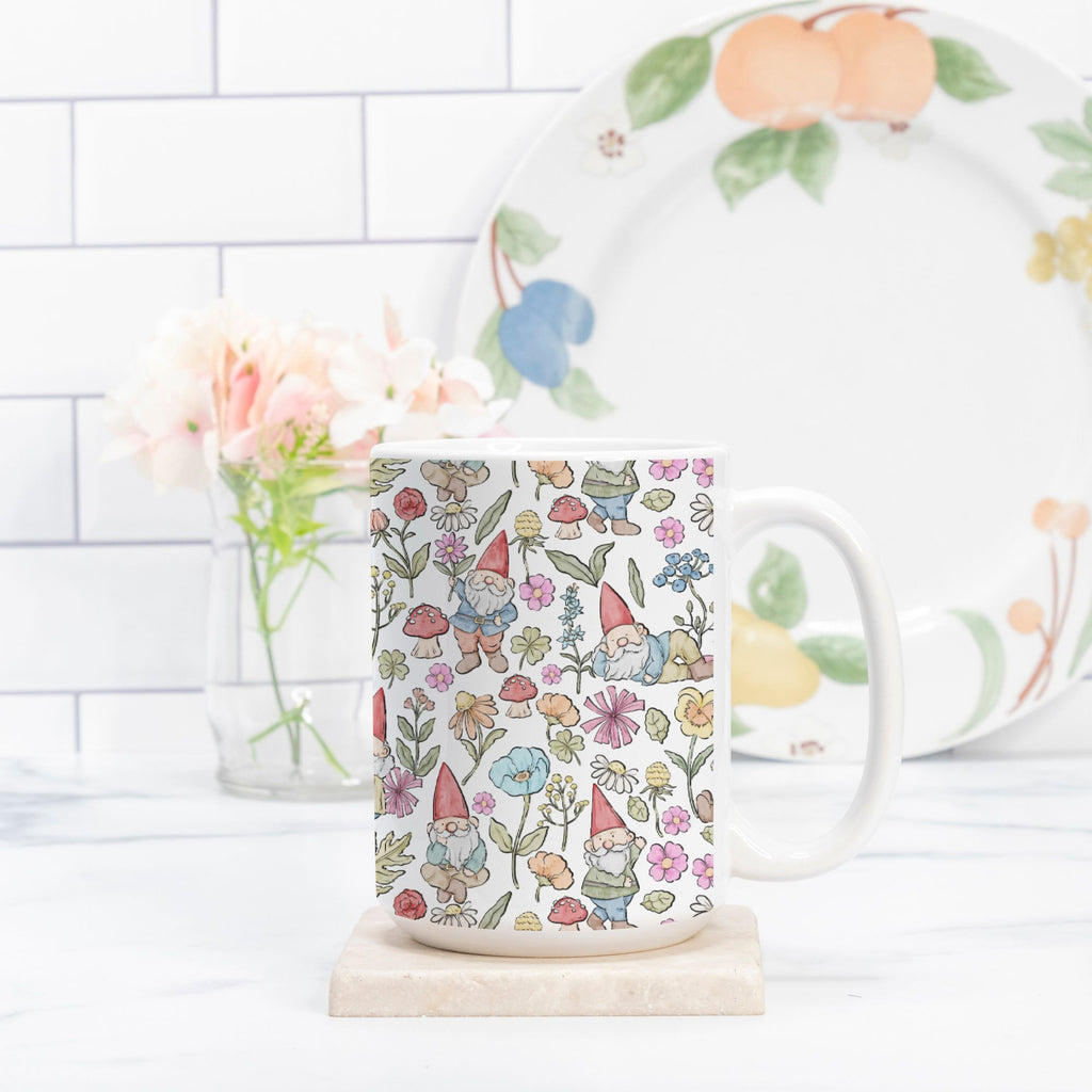 Mug with gnome and floral pattern on a white surface with a blurred background