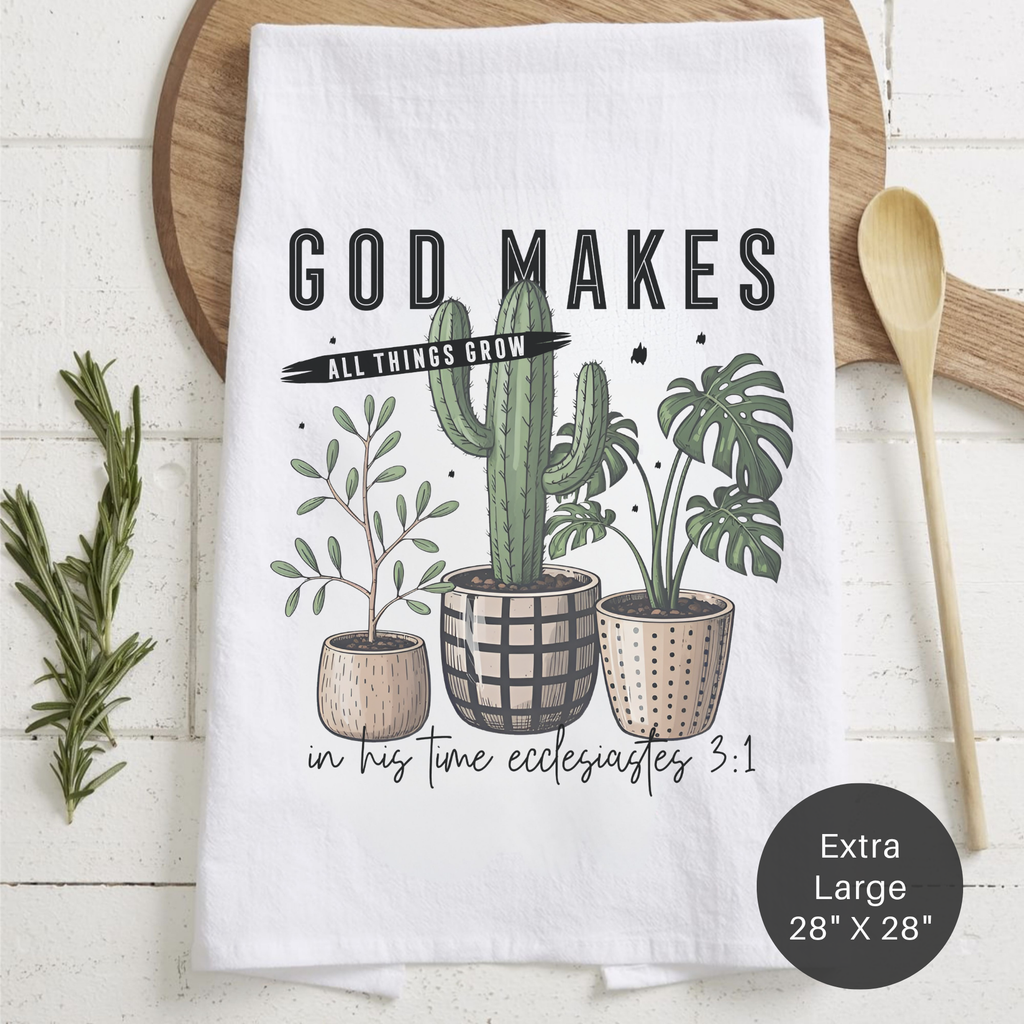 Kitchen towel with plant design and inspirational quote on a wooden surface