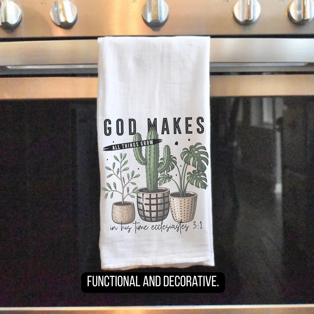 Decorative towel with plants and text hanging on a stove handle