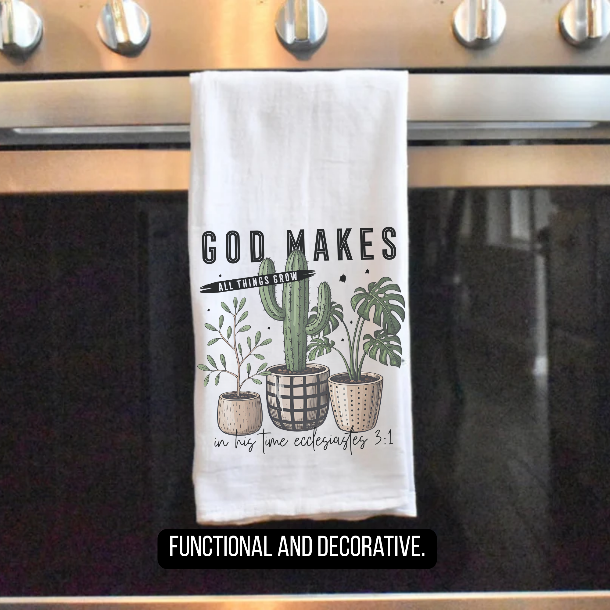 Decorative towel with plants and text hanging on a stove handle