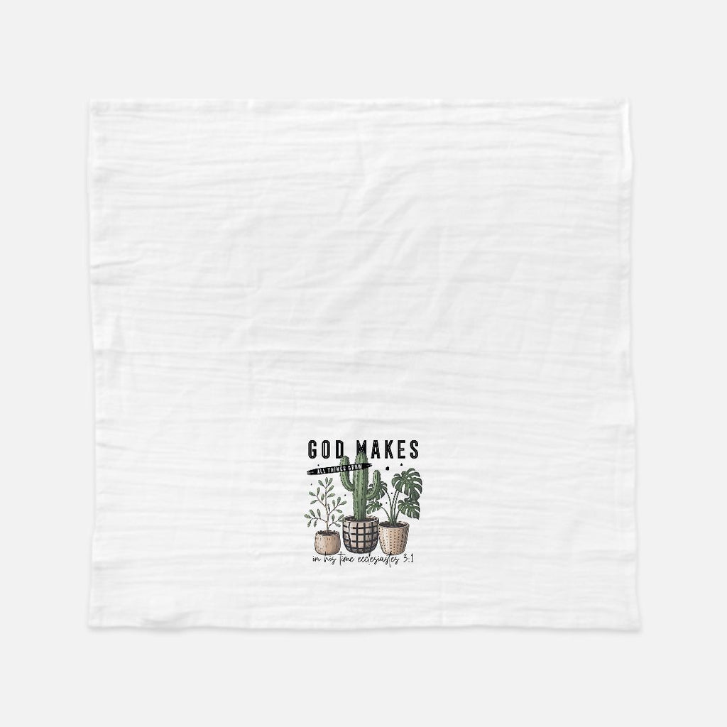White towel with plant design and text on a white background