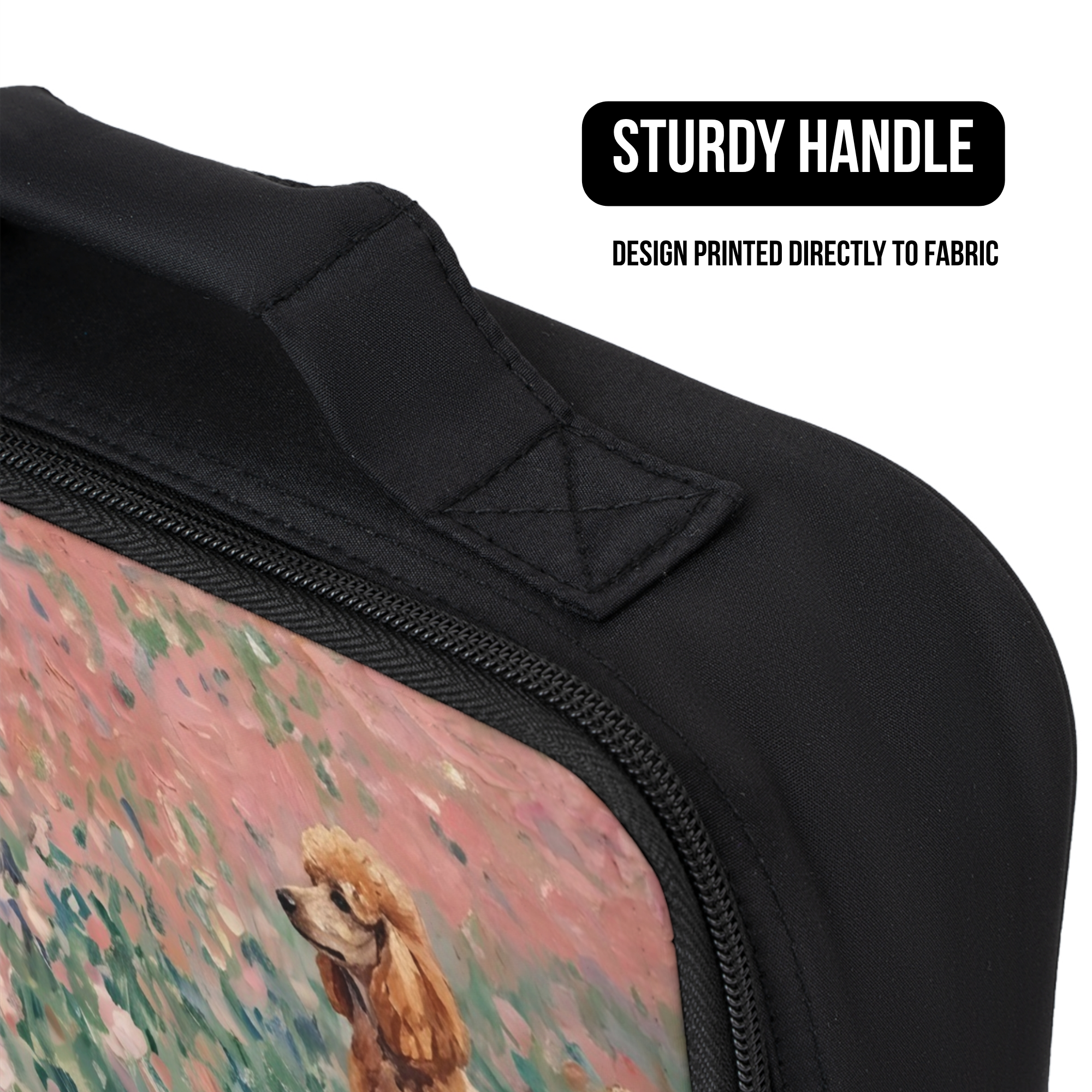 Black bag with a design of a poodle dog in a field printed directly to fabric, featuring a sturdy handle.