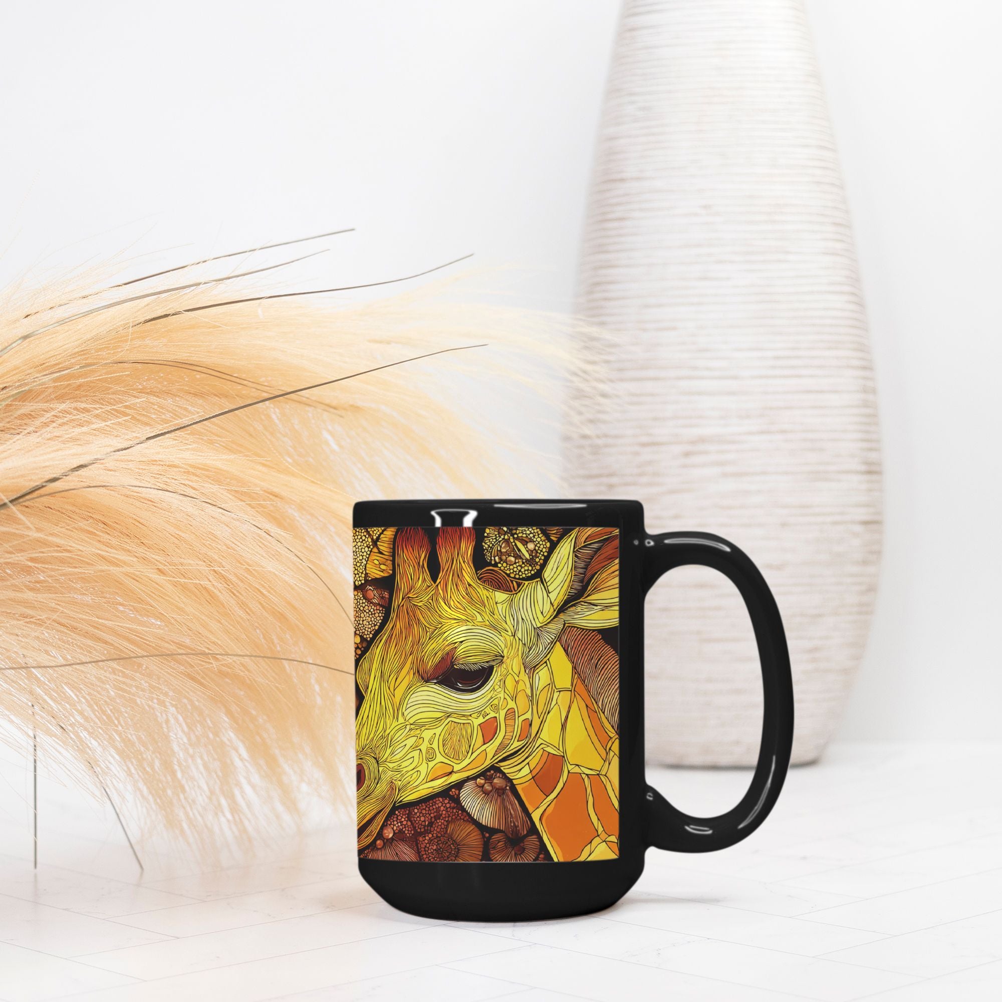 Black mug with a colorful giraffe design on a white surface with decorative elements.