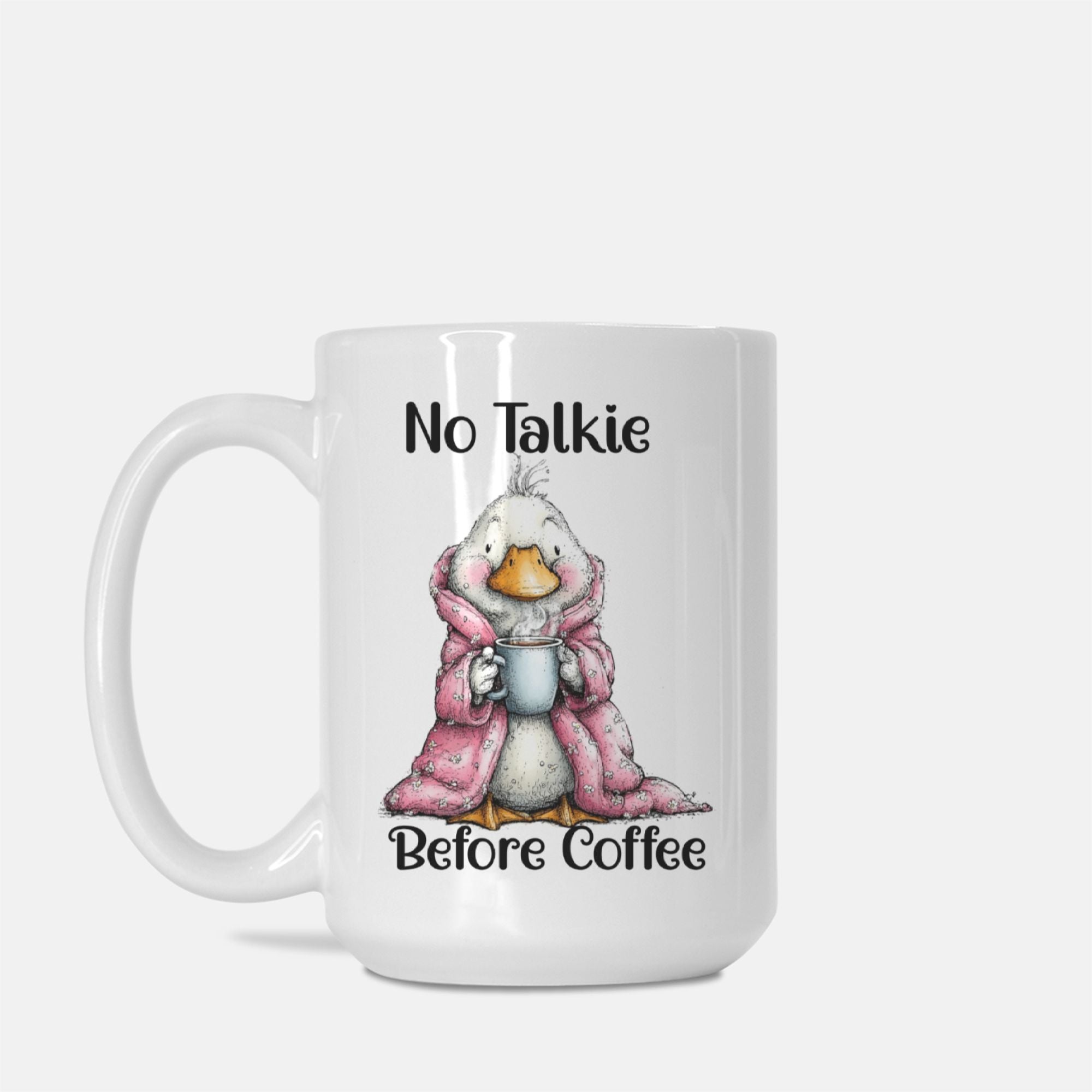 Mug with a cartoon duck in a pink robe holding a coffee cup, text 'No Talkie Before Coffee' on a white background