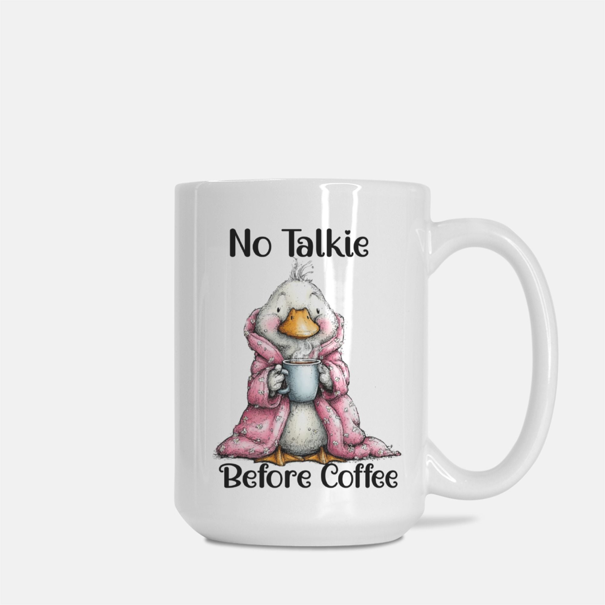 Mug with a cartoon goose in a pink robe holding a coffee cup, text 'No Talkie Before Coffee' on a white background