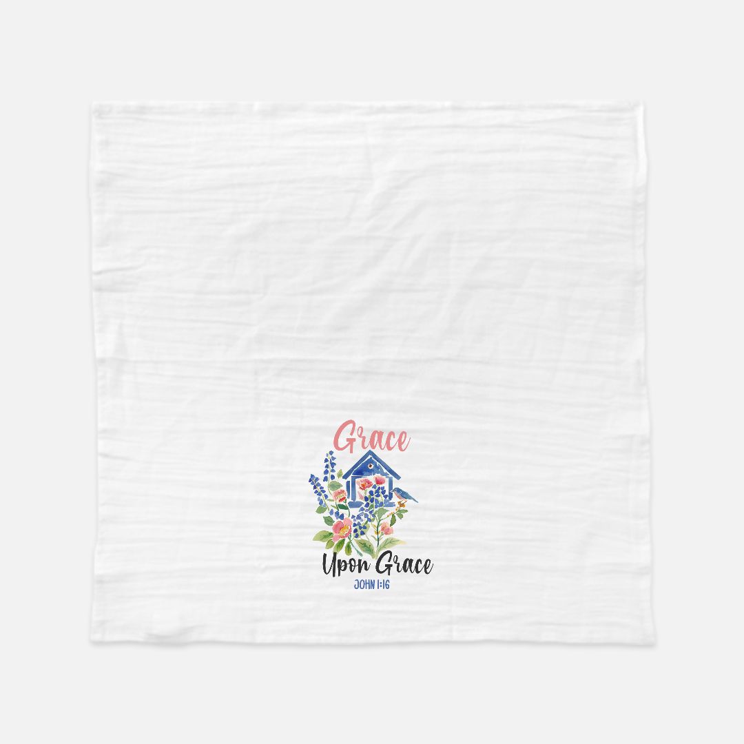 Extra large white tea towel with floral design and text on a white background