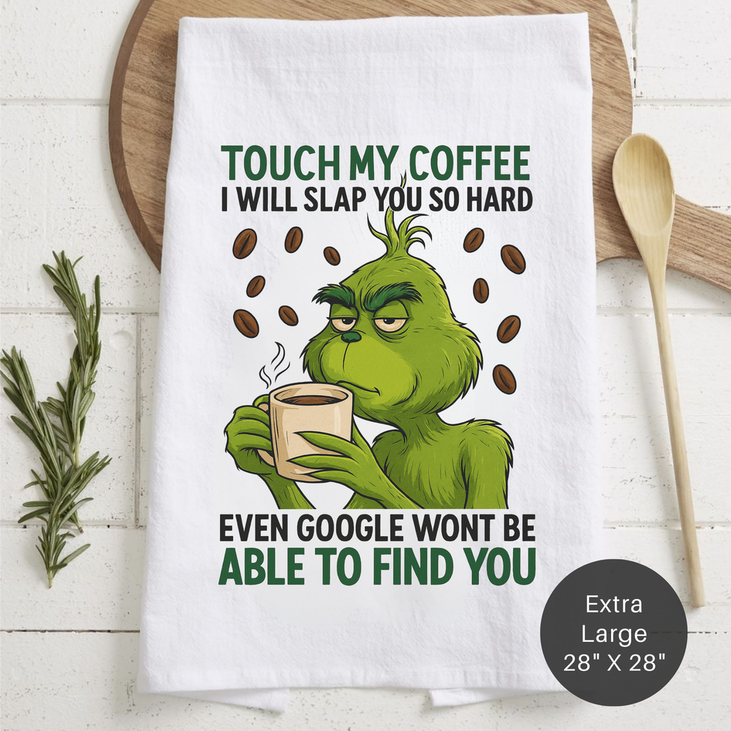 Tea towel with Grinch design holding a coffee cup, text about coffee, and dimensions.