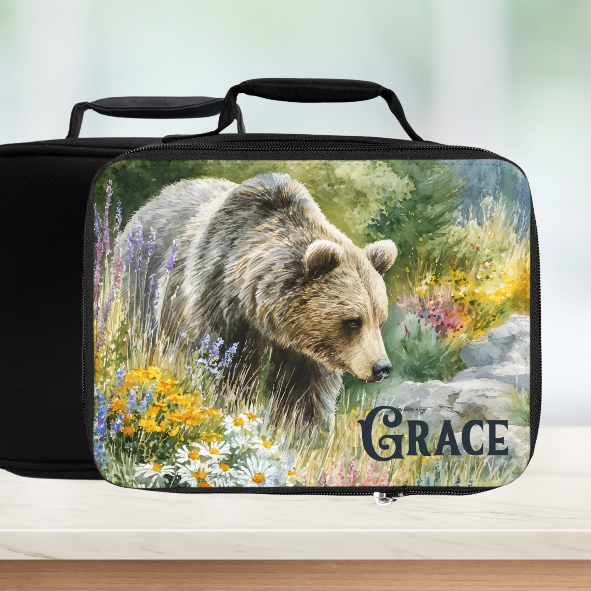 Black lunch bag with a bear design and 'Grace' personalized text on a white background