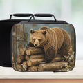 Black lunch bag with bear design on a wooden surface
