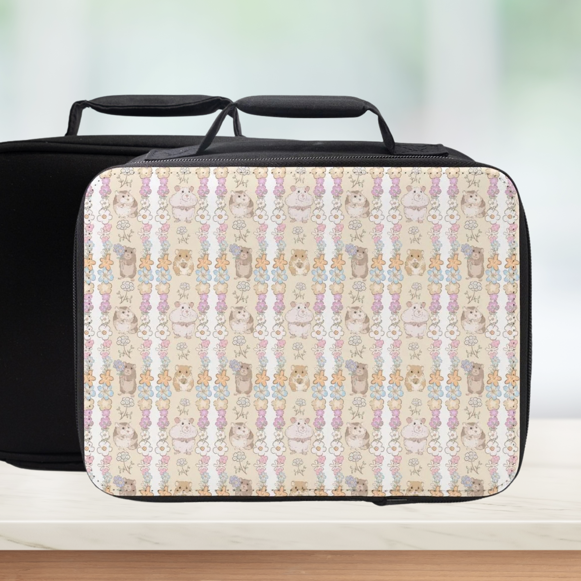 Black and hamster patterned lunch bag on a light background