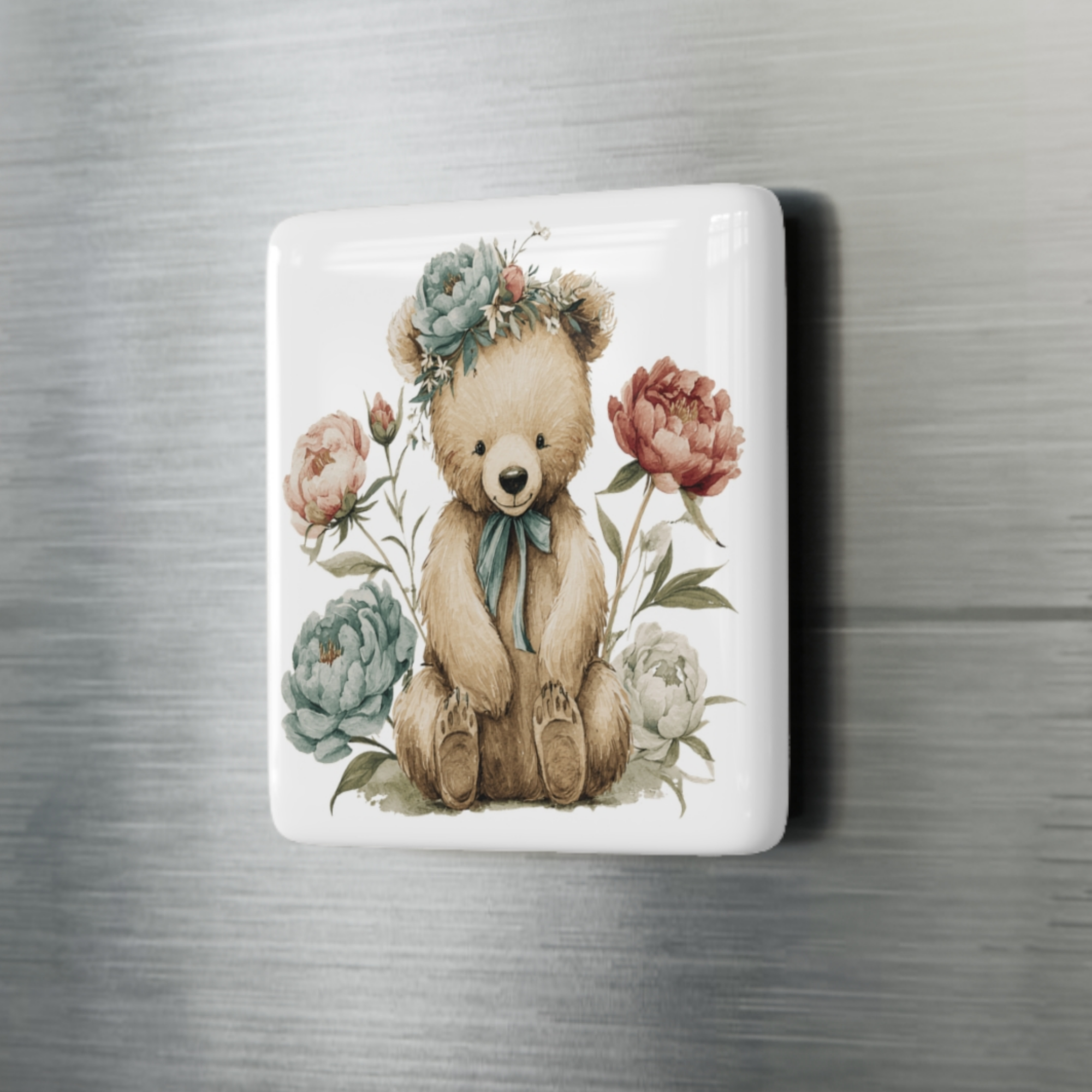Decorative square porcelain magnet with a teddy bear and flowers on a metallic surface