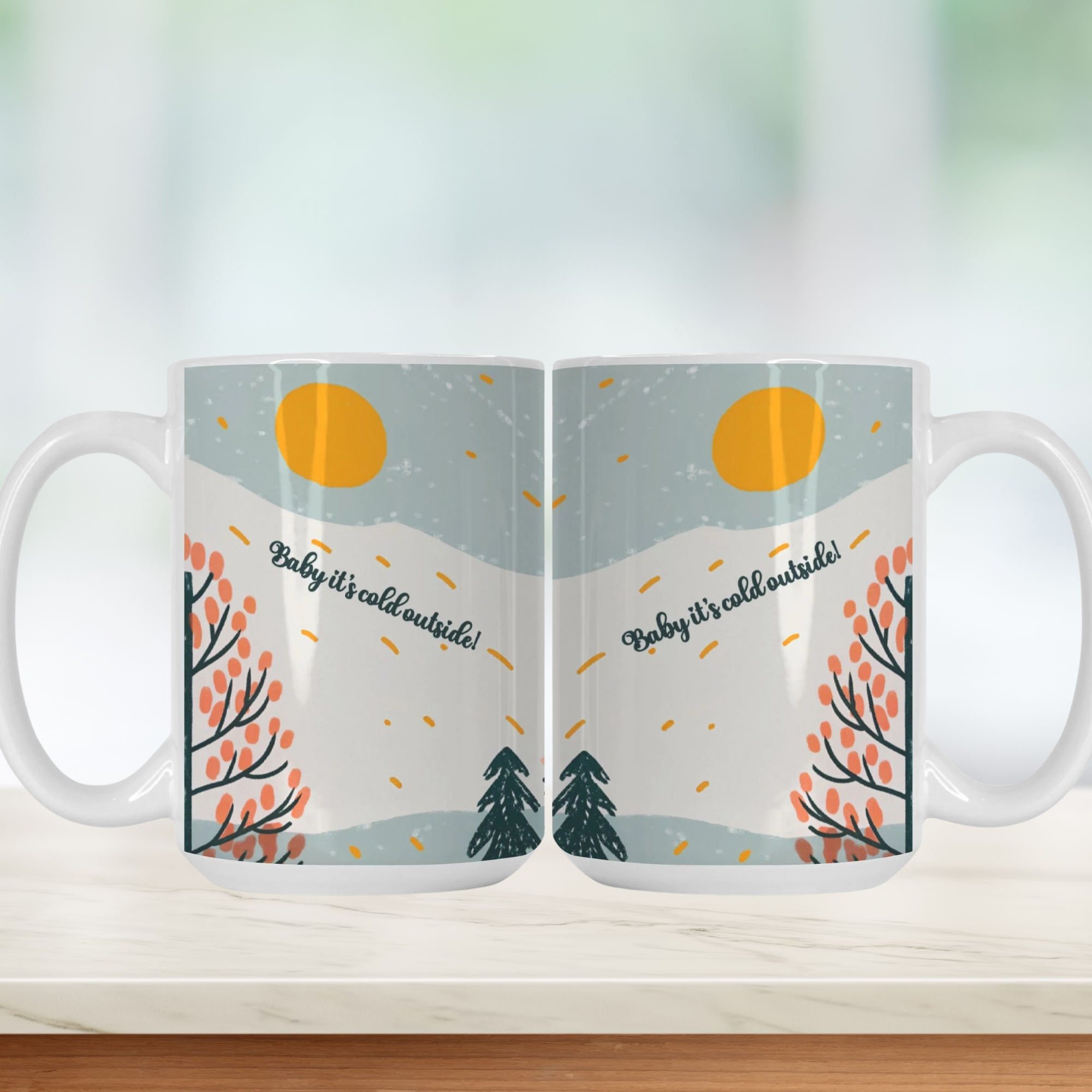 Two mugs with a winter scene design on a white surface.