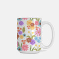 White mug with colorful floral pattern on a white background