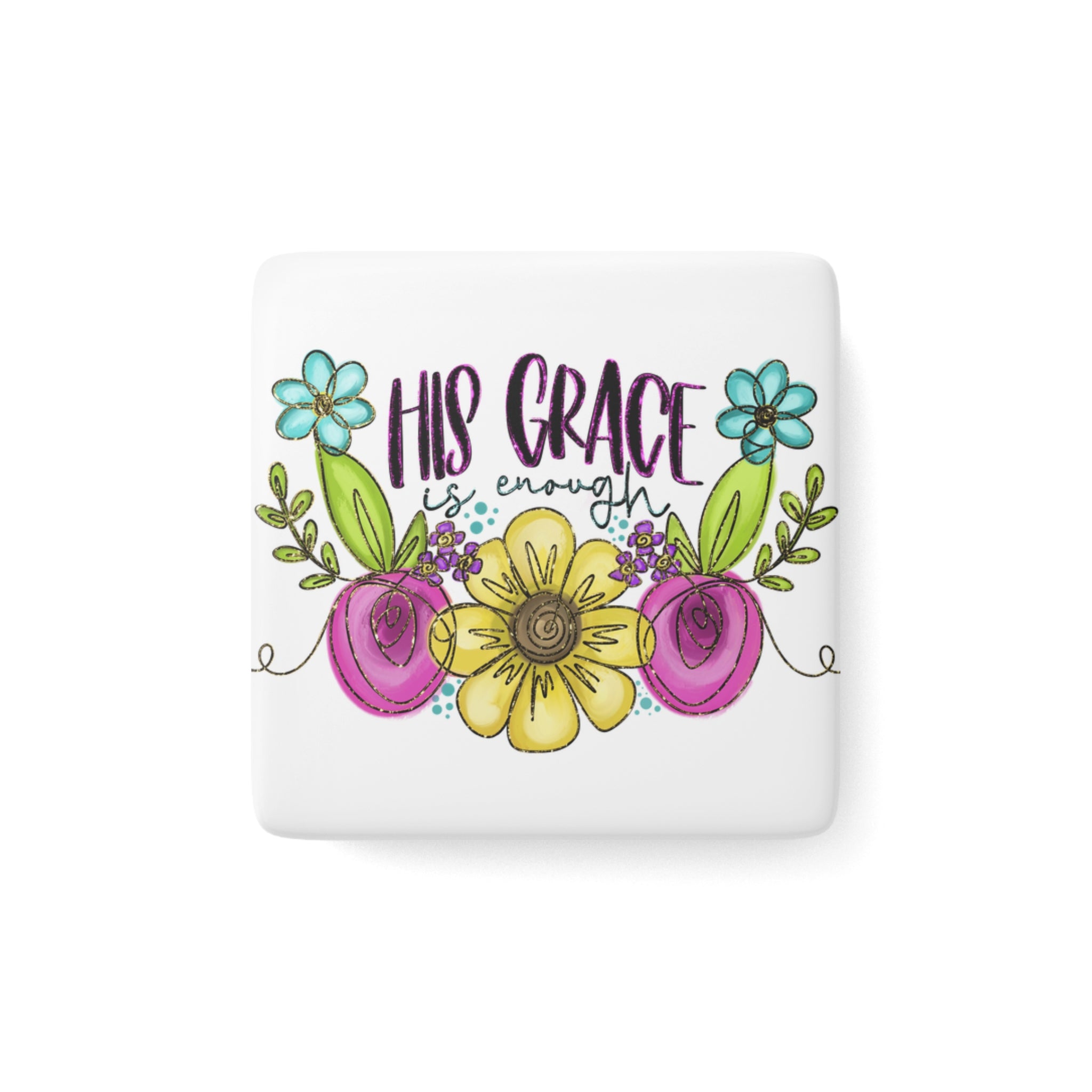 Decorative porcelain magnet with floral design and 'His Grace is Enough' text on a white background