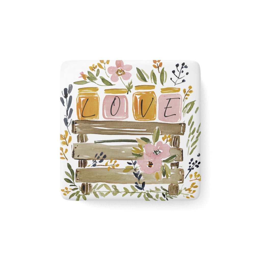 Decorative square porcelain magnet with 'LOVE' honey jars and floral designs on a white background