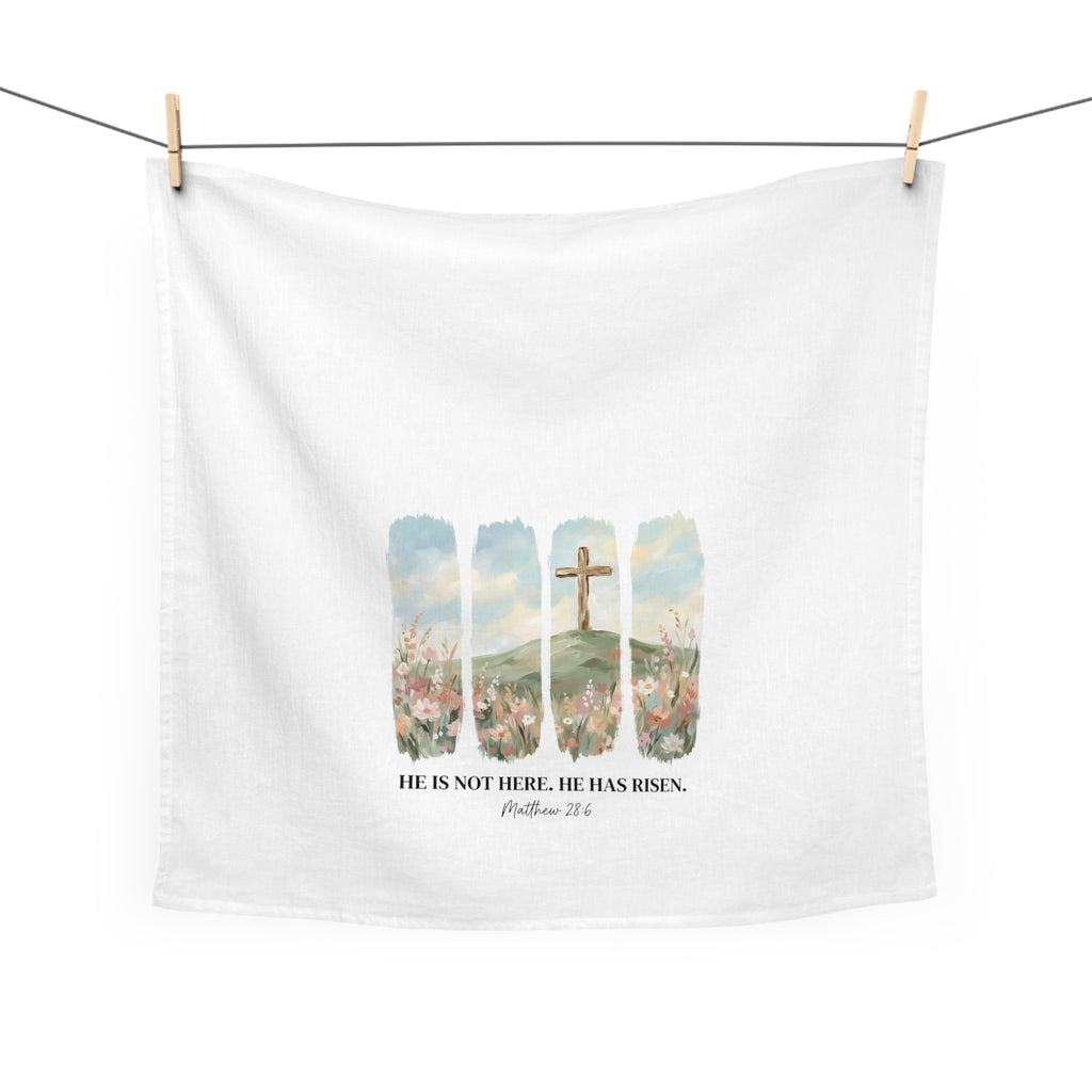 White tea towel with Easter-themed design featuring a cross and text on a white background