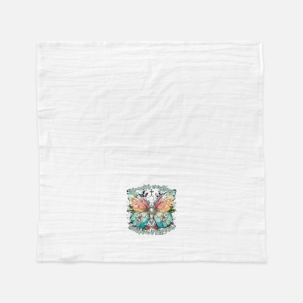 White tea towel with colorful butterfly design on a white fabric background