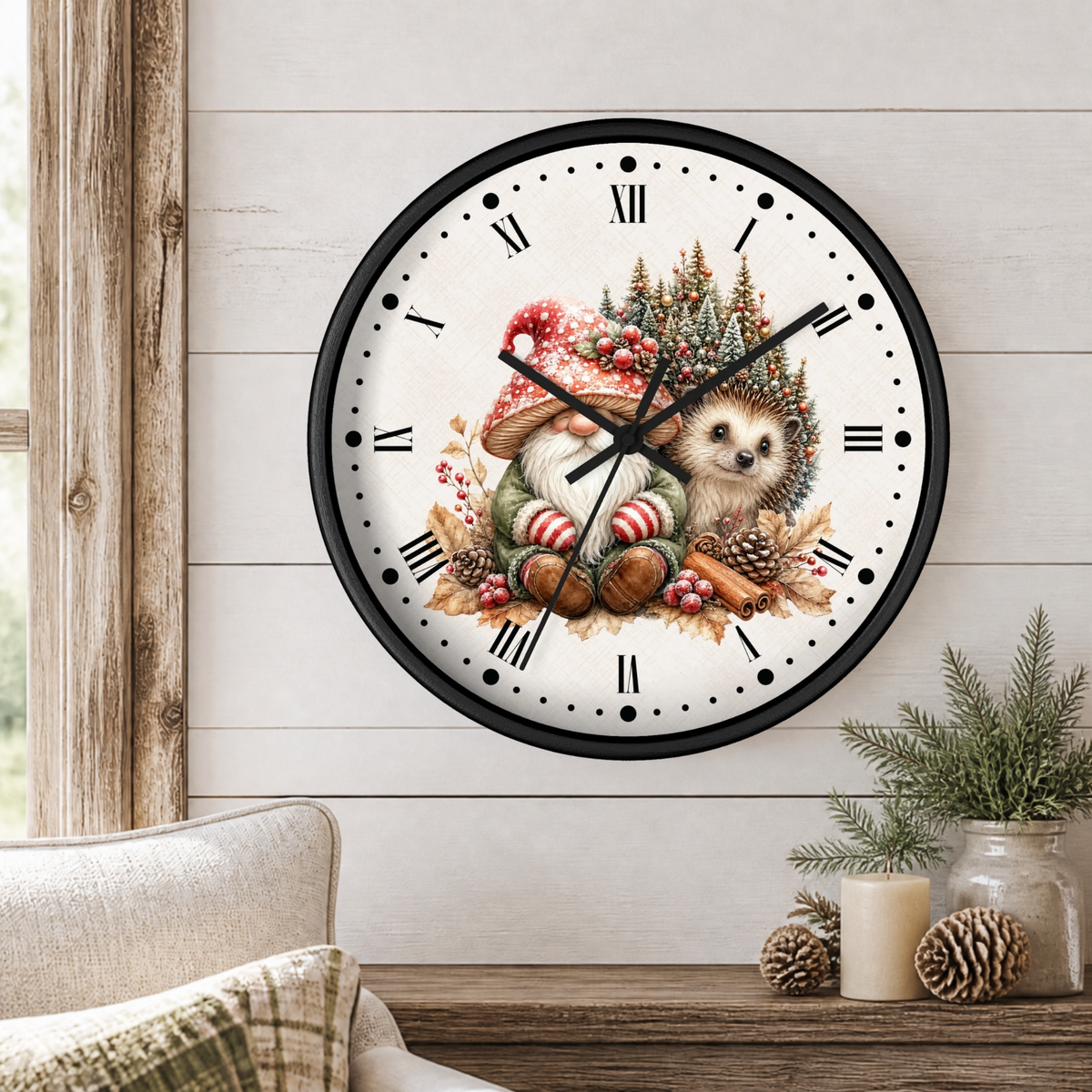 A round wall clock with a black frame and a whimsical holiday illustration of a hedgehog in a Santa hat, surrounded by pinecones, cinnamon sticks, and evergreen branches on a white background. The clock is mounted on a white wood-paneled wall above a rustic wooden table with a candle and pinecones.
