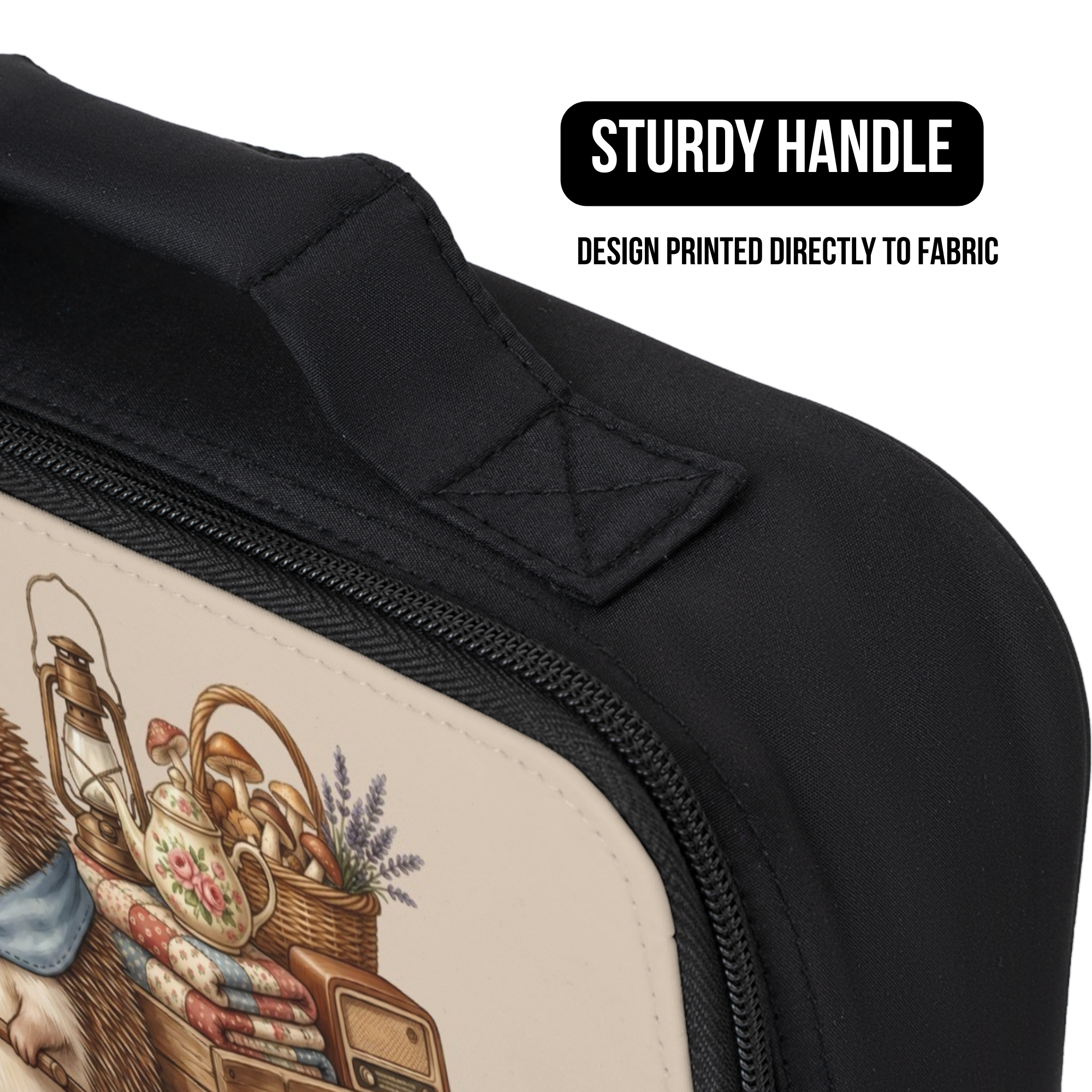 Black bag with a printed design on fabric, featuring a sturdy handle.